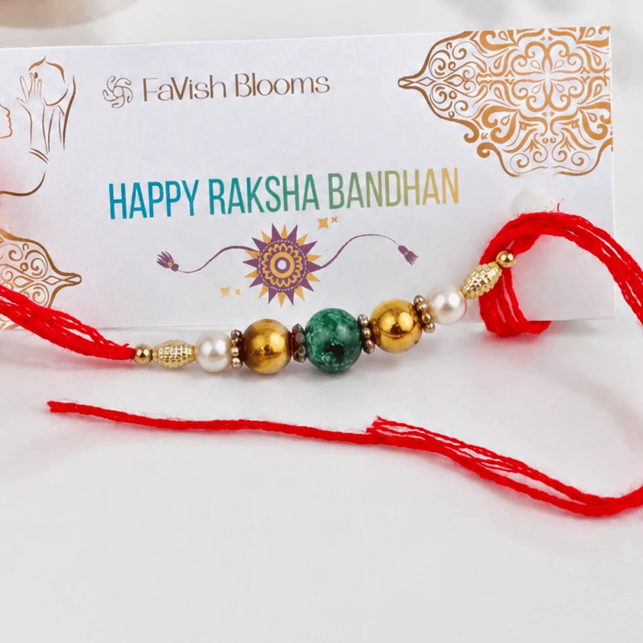 Elegant Green Beaded Rakhi for brother featuring premium green beads, golden embellishments, and festive red thread