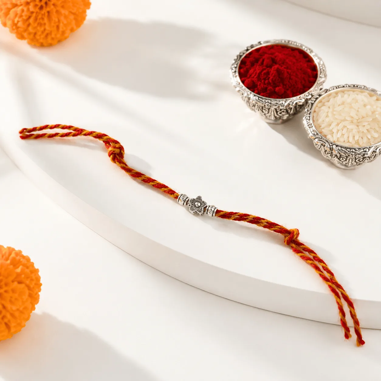 Elegant Silver Floral Bead Rakhi for Raksha Bandhan gifting