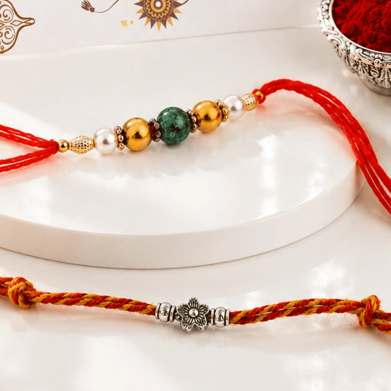 Premium silver flower Rakhi set with green beads for Raksha Bandhan